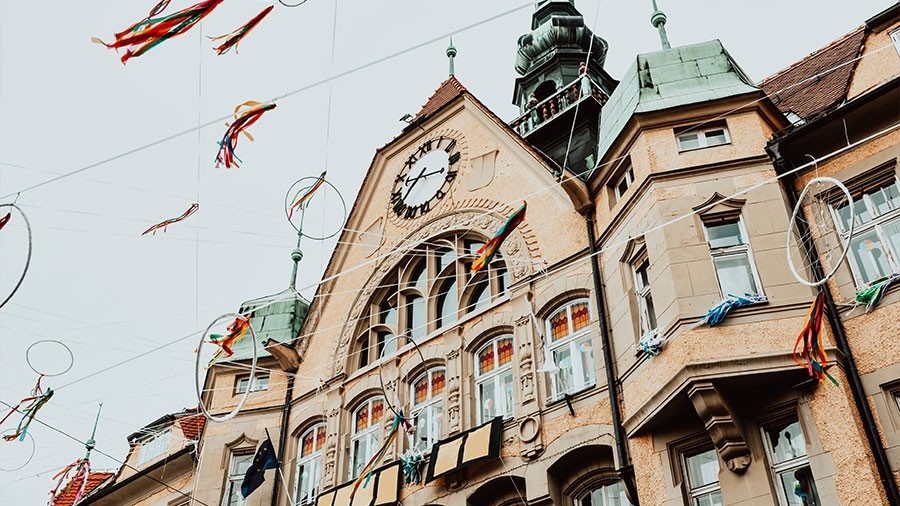 Facade of City Hall and decorations during traditional spring Slovenian carnival - Kurentovanje. Located in town square. Ptuj, Slovenia, Europe.