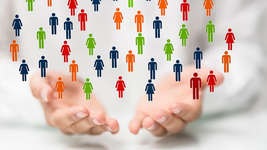 Concept image of Human resources management - people icons floating above a pair of hands