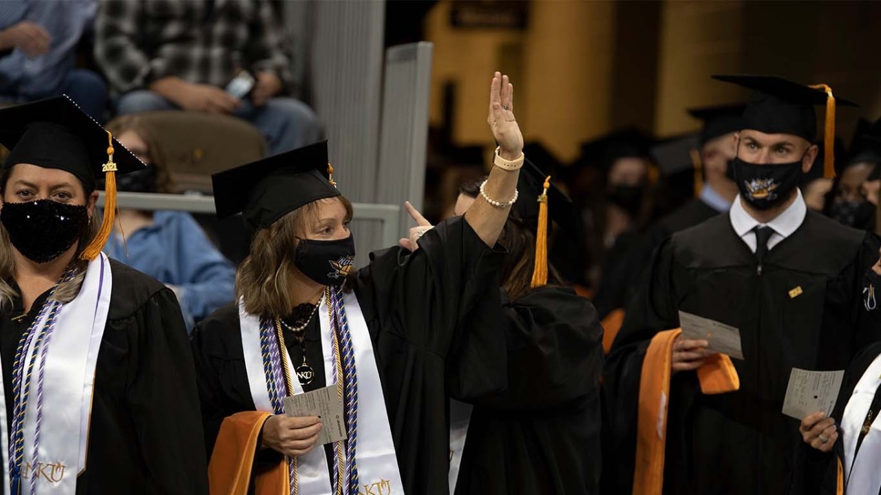 NKU Fall 2021 Commencement Ceremony - student waves into crowd