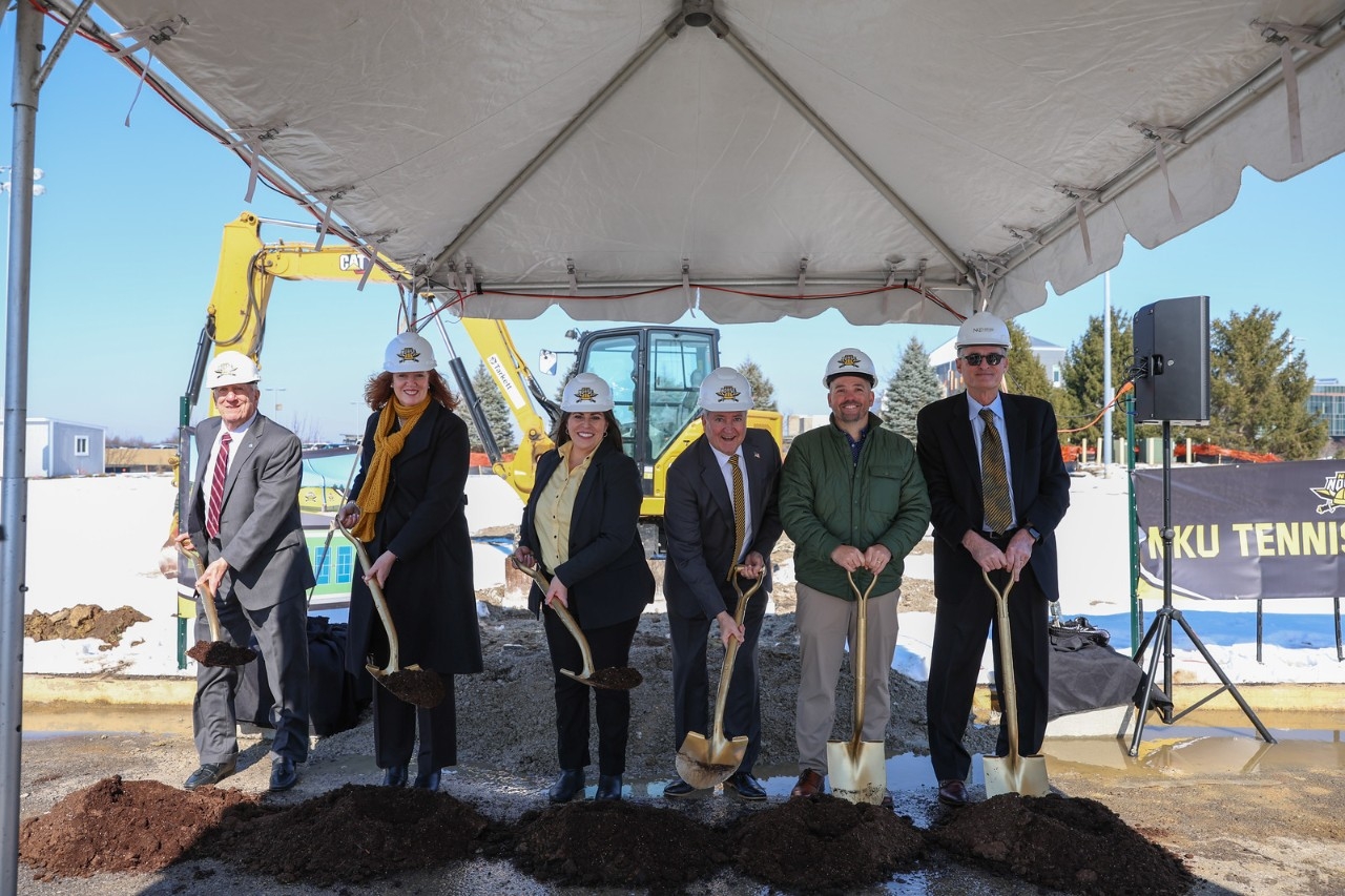 University and community leaders shovel dirt at the NKU Tennis Complex groundbreaking ceremony.