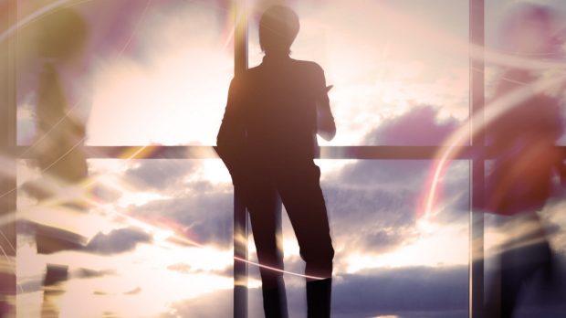 Silhouette of person against a bright sky