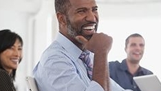 People smiling in a meeting