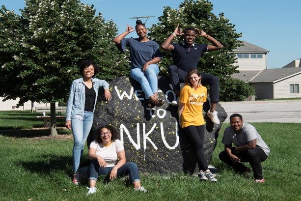 students gathered around NKU rock