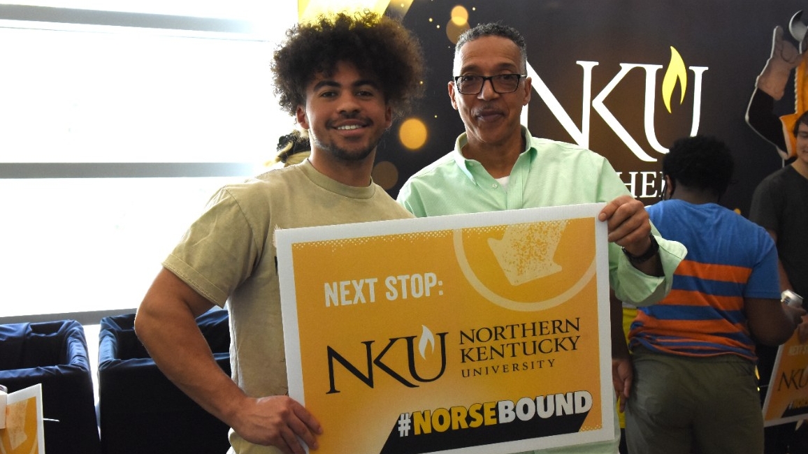 Newly admitted student with Norse Bound sign